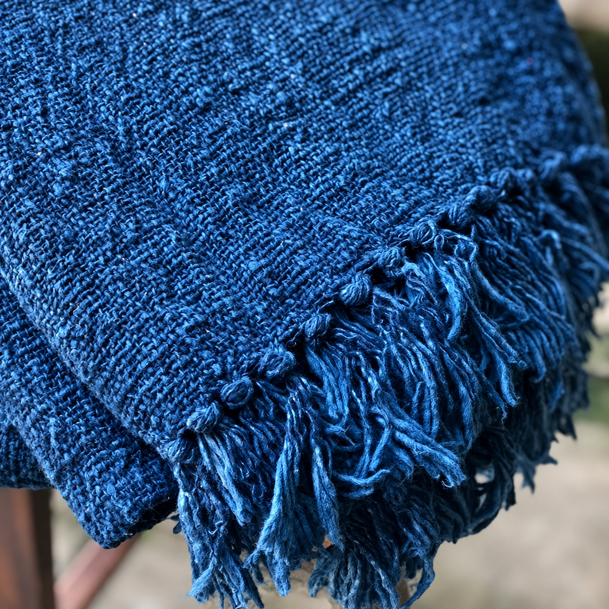 Close-up of the woven texture and fibers of indigo cloth